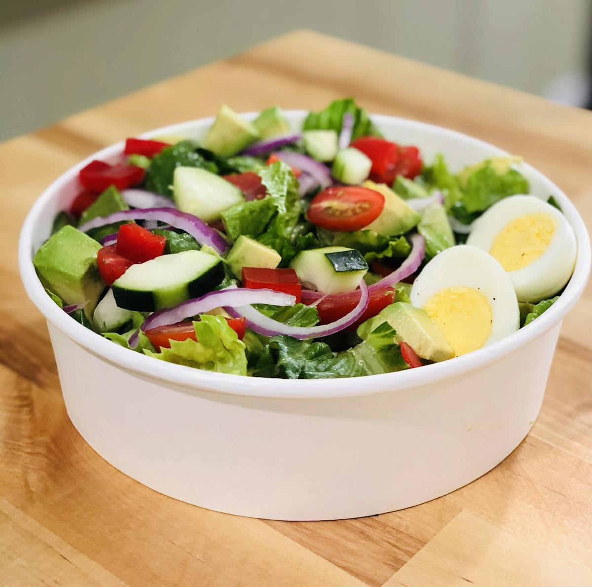 a bowl of salad on a plate